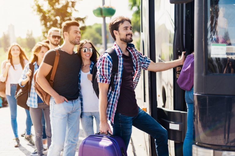 group of travelers about to ride the bus